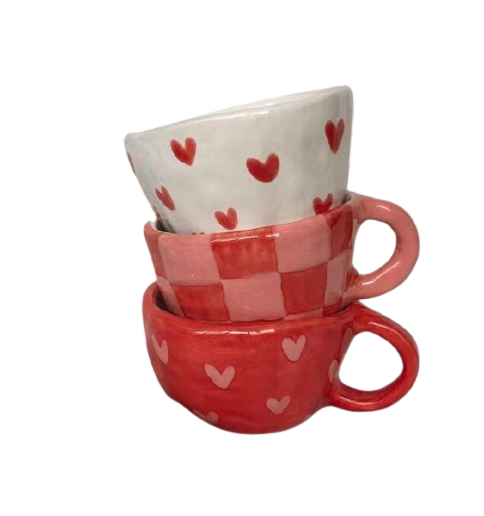 A stack of cups with heart patterns